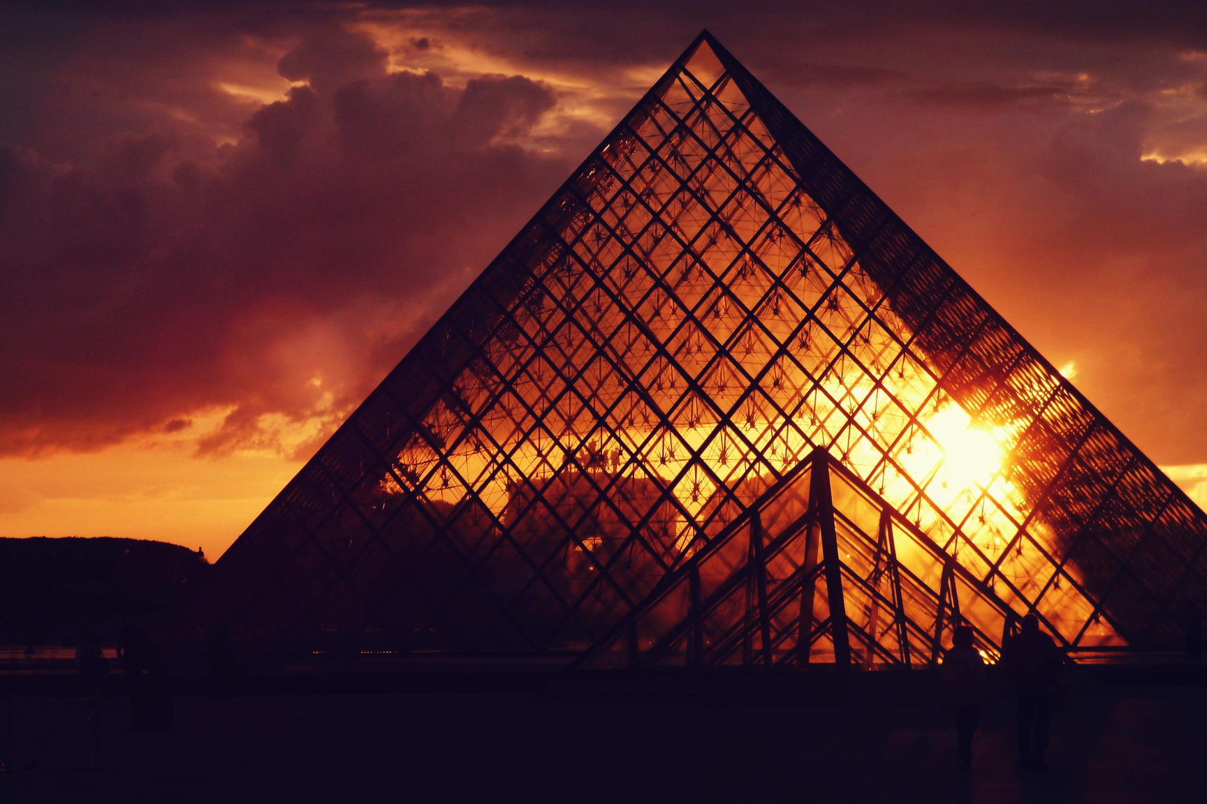 The Glass Pyramid in Louvre Museum in Paris at Sunset